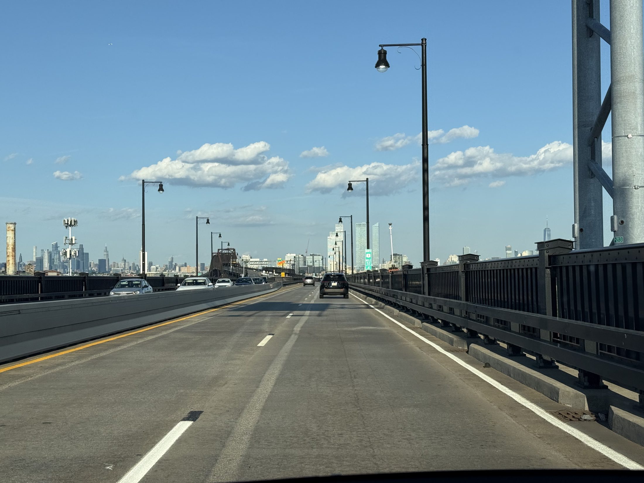 Skylines on both sides from the Pulaski Skyway deck